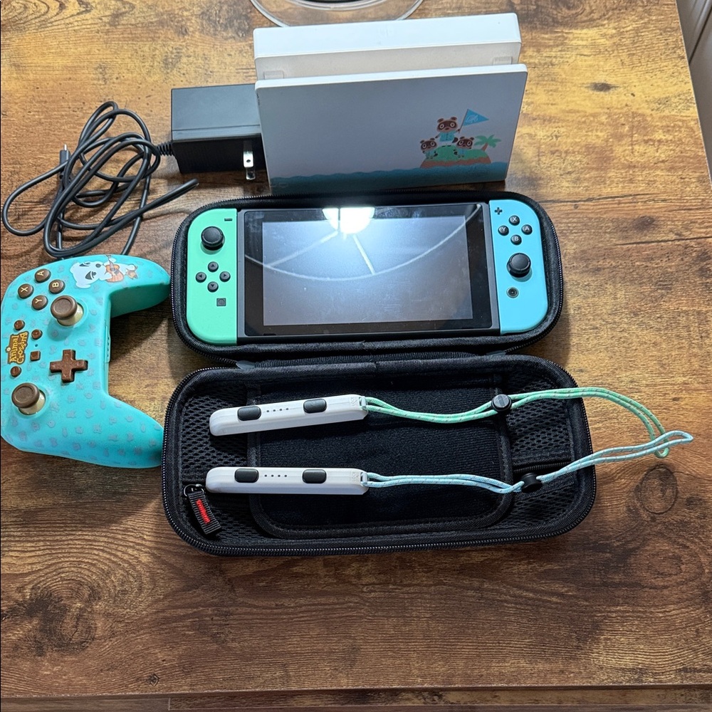 Nintendo Switch with Blue and Green Joy-Con and Accessories